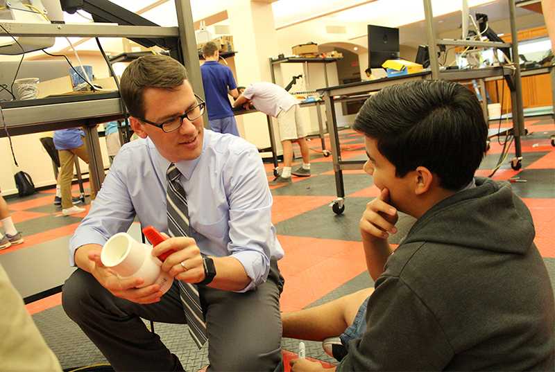 Photo by Cory Wyman ’16 - Mr. Bopp talks with a student about the feasibility of his project, Tuesday April 26. Mr. Bopp will be leaving Brophy at the end of this year after 11 years as a staff member at the school.