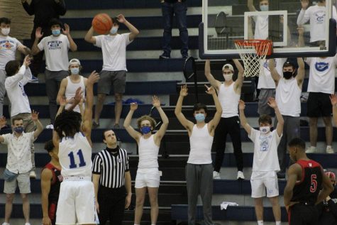 Student fans cheer on AJ Rollins as shoots a free throw vs. Westside. The Birdcage returned for the annual rivalry game. 