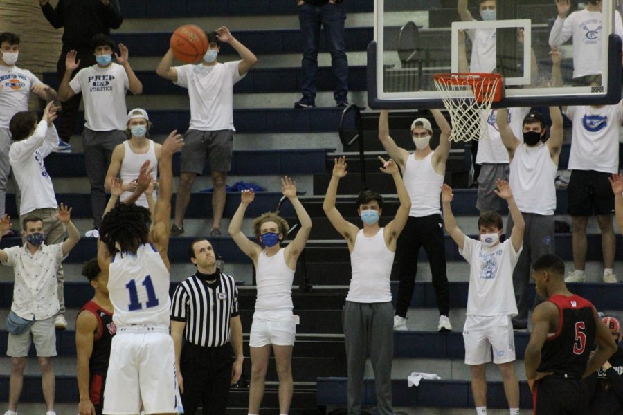 Student+fans+cheer+on+AJ+Rollins+as+shoots+a+free+throw+vs.+Westside.+The+Birdcage+returned+for+the+annual+rivalry+game.+