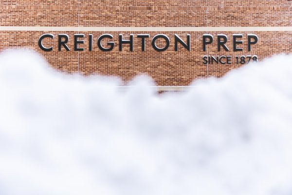 Sidewalks were left covered in snow during the breaks in school on Monday in Tuesday. Creighton Preps signage remained readable even with the heavy snow conditions. 
