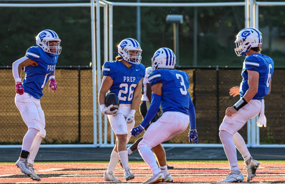 The Junior Jays celebrate with Jacob Ruby after he finds the endzone. 