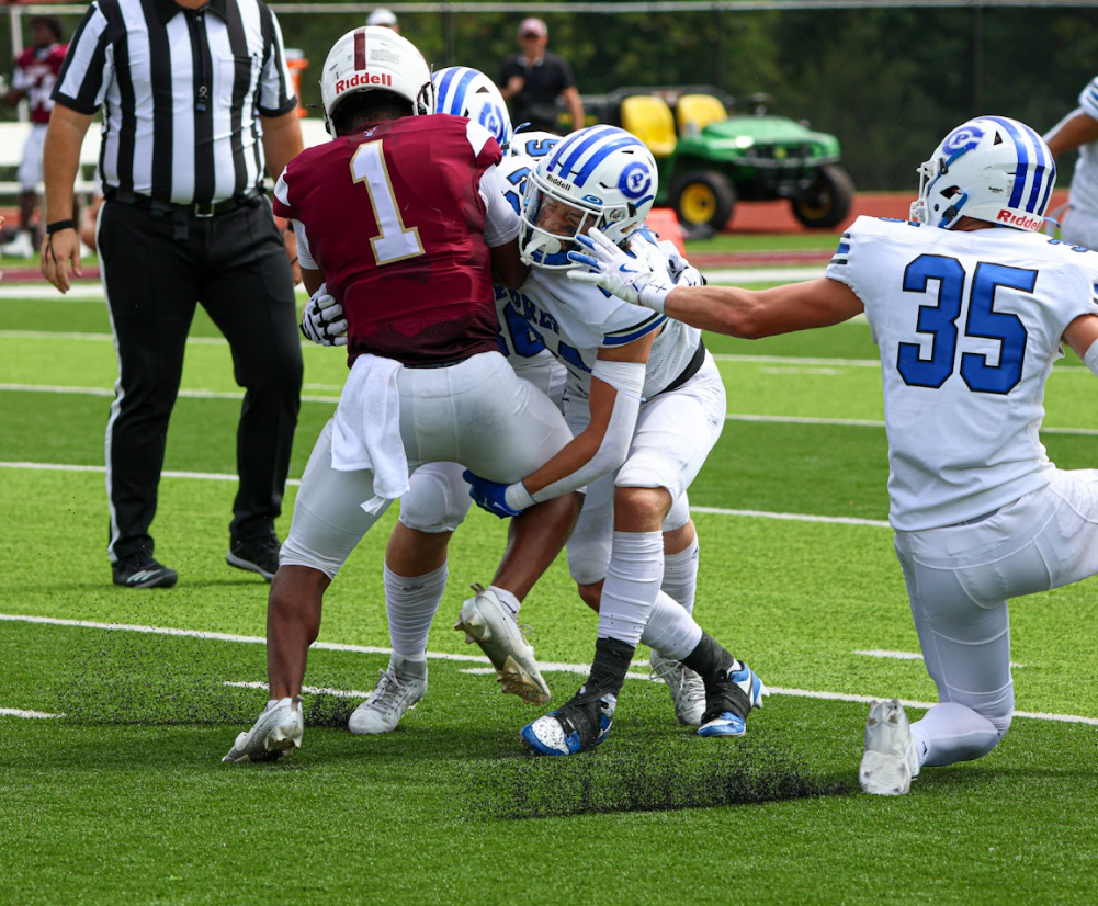 Multiple Junior Jays wrap up a De Smet running back.