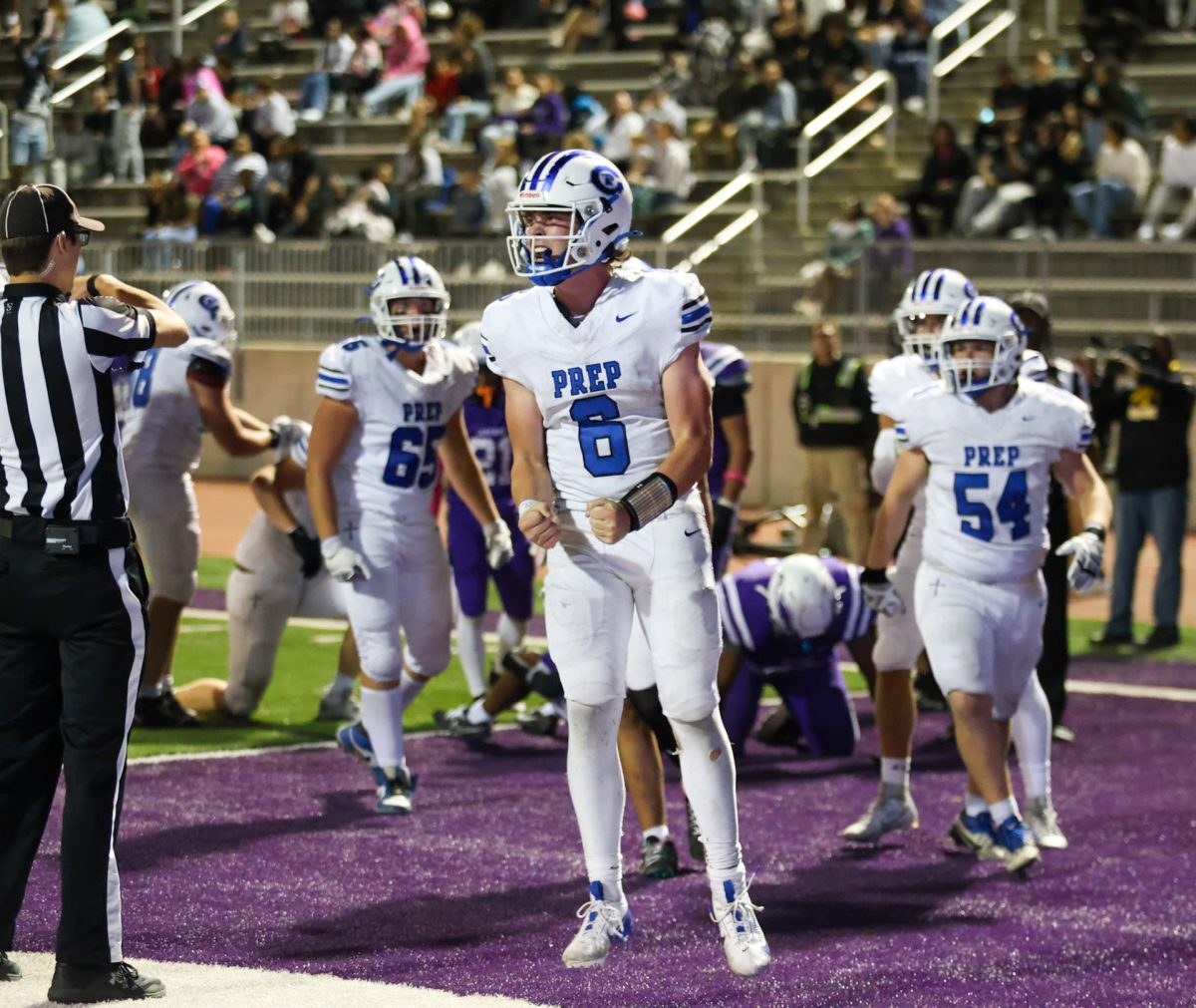 Quarterback Tony Coniglio celebrates after his fourth rushing touchdown in a loss to Central.