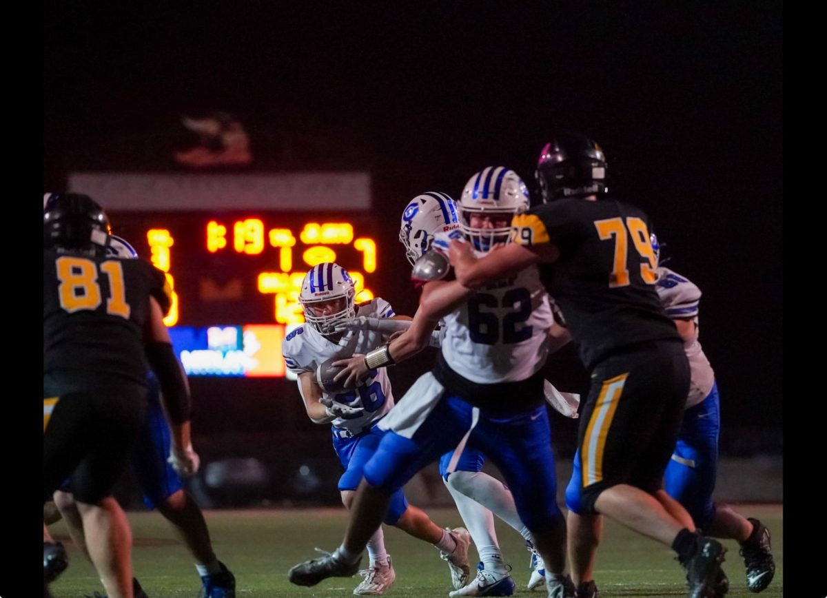 Running back Jacob Ruby takes the handoff from quarterback Tony Coniglio. 